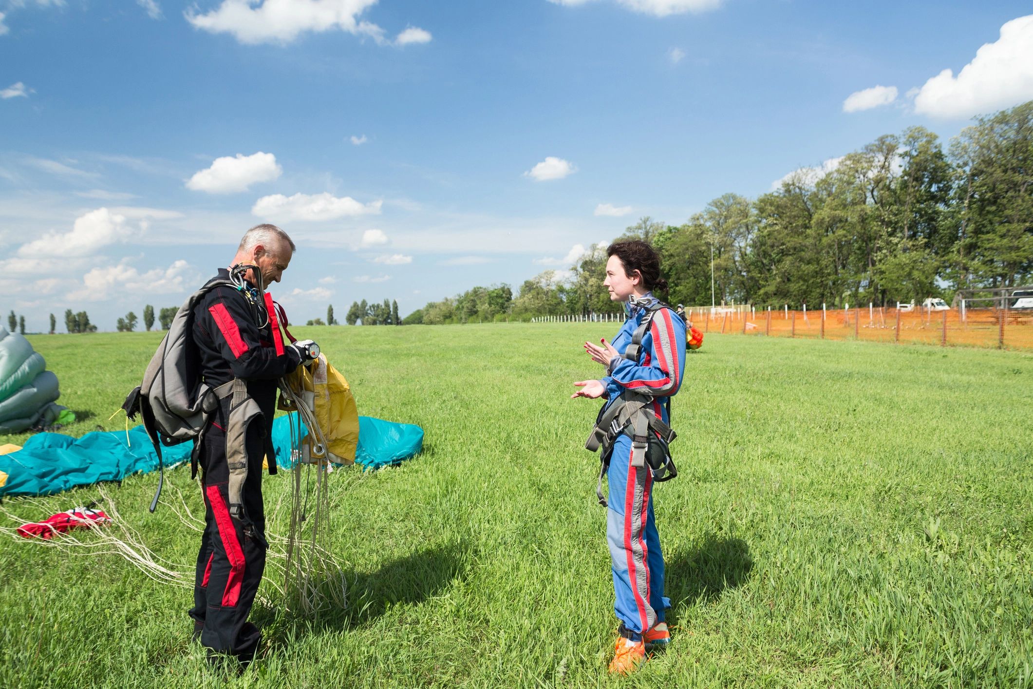 Tandem jumpers celebrating after landing